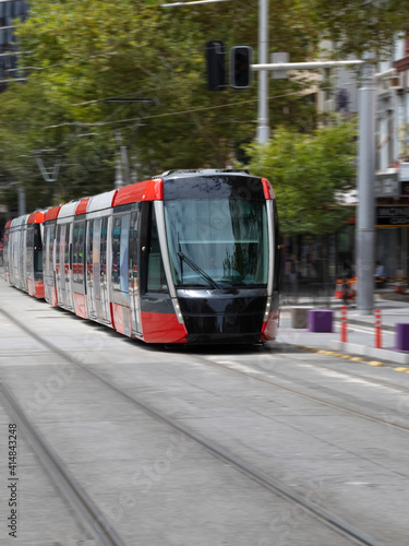 Tram moving through George St in Sydney NSW Australia