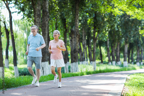 Old couple jogging in outdoor park