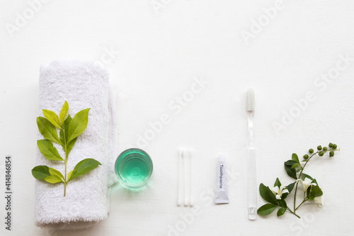 toothbrush ,toothpaste ,terry clothes ,cotton ,mouthwash for health care oral cavity arrangement flat lay style on background white