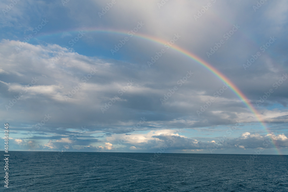 Seascape with a rainbow over the water. Landscape with Baltic sea after rain.