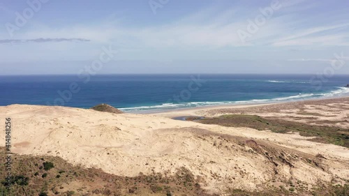 Giant Sand Dunes With Blue Sea And Beach In Summer At Cape Reinga, Aupouri Peninsula At North Island Of New Zealand. - aerial photo