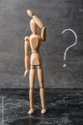 Wooden mannequin with quest...