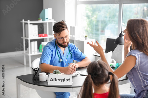 Little girl and her mother visiting allergist in clinic