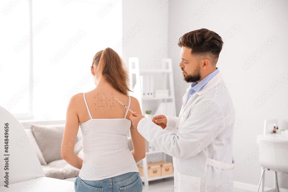 Young woman undergoing allergen skin test in clinic