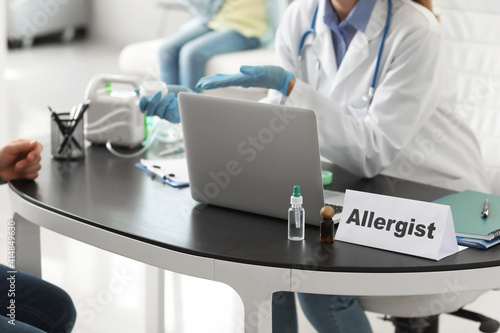 Allergist giving remedy to patient in clinic