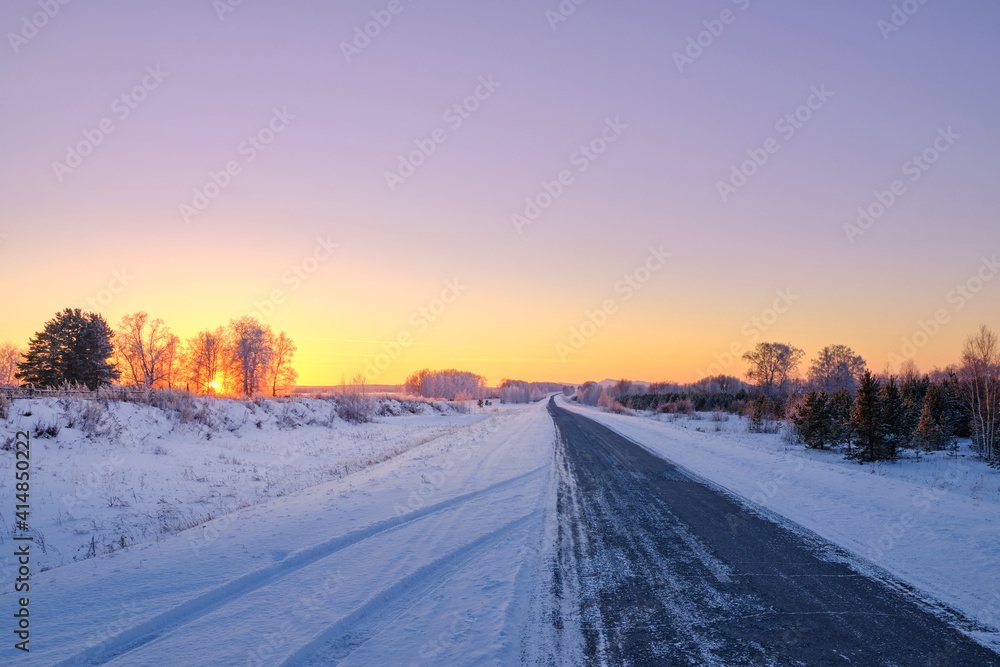 winter road in beautiful sunset