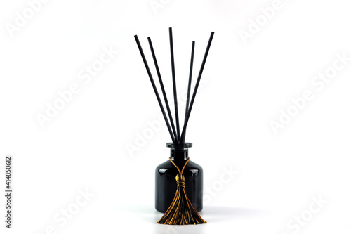 luxury aroma scent reed diffuser glass bottle is on the white table to creat romantic and relax ambient in the bedroom isolated on white cement wall background in the morning for happy valentine day