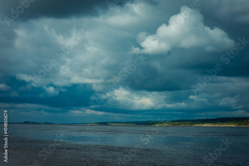 landscape with a river and a stormy sky, selective focus