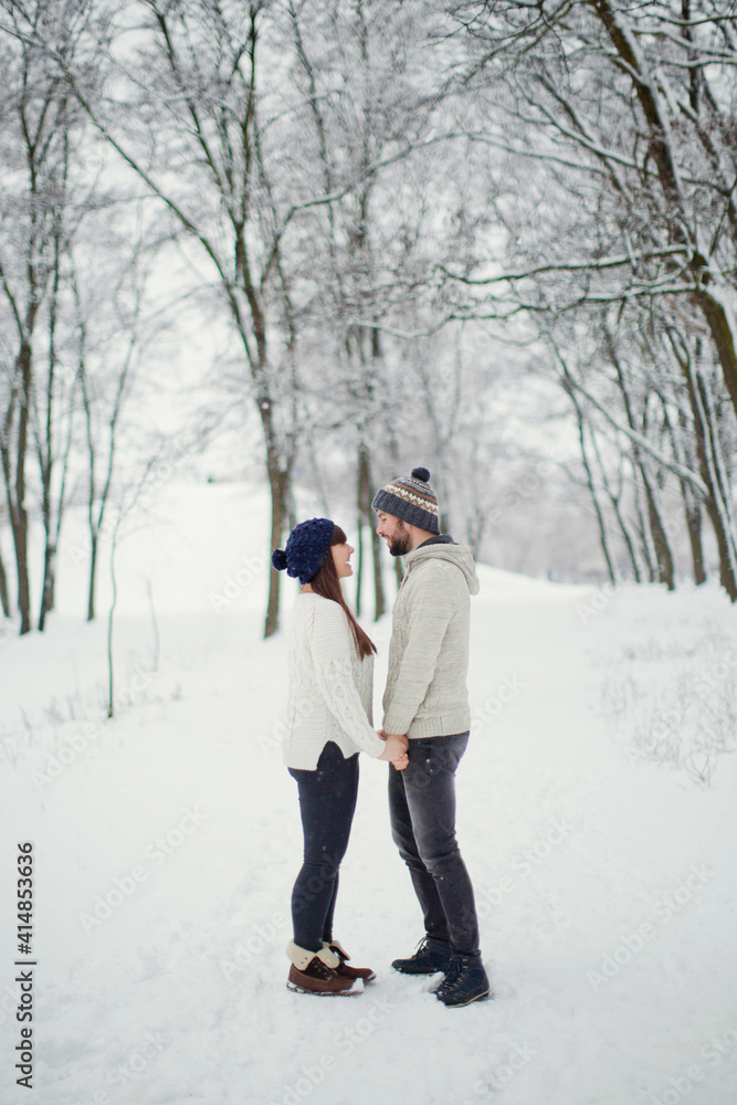 Man,woman couple at snow forest