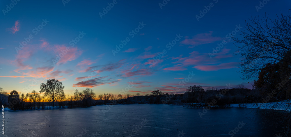 Winter sunrise over the frozen Huron river