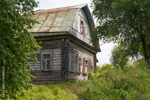 Old wooden abandoned house on a hill