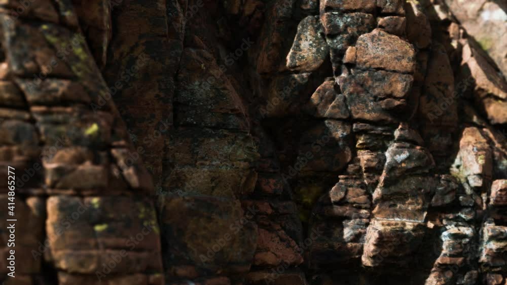 Solid rock with cracks close up