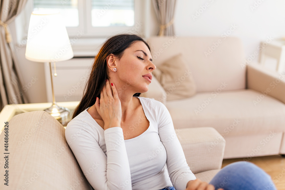 Close up of sad young woman with neckache. woman with chronic pain syndrome fibromyalgia suffering from acute neckaches suffering from neck pain Close up of sad young woman with neckache. woman with chronic pain syndrome fibromyalgia suffering from acute neckaches suffering from neck pain