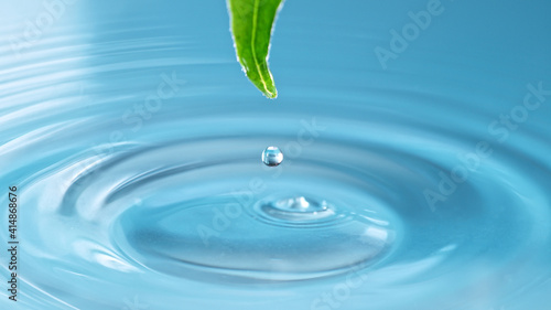 Blue water drop with green ...