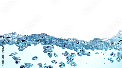 Waves of blue water on whit...