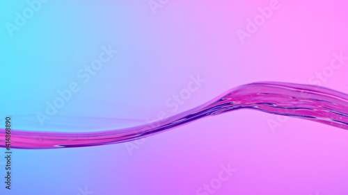 Waves of water on neon back...