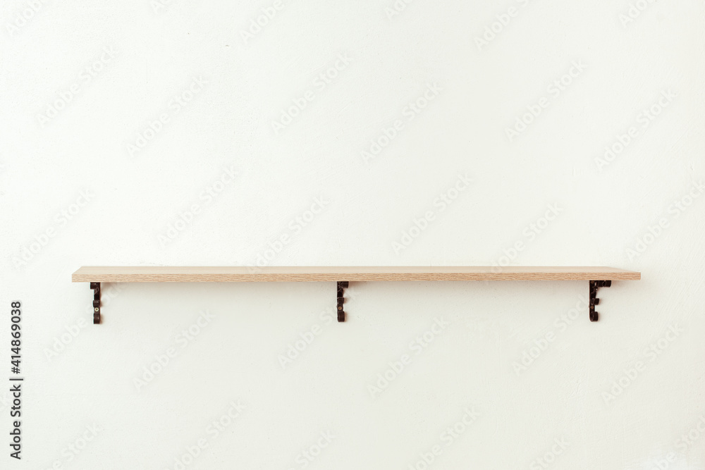 Empty wooden shelf on white cement wall background, product display montage Empty wooden shelf on white cement wall background, product display montage