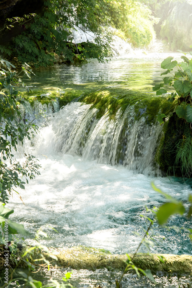 Fototapeta premium Morning view of waterfall cascade in the forest