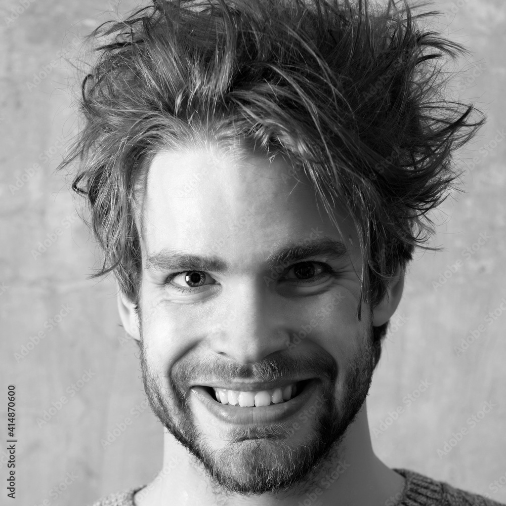 Smiling man face, close up. Young unshaven sexy guy caucasian gay portrait Smiling man face, close up. Young unshaven sexy guy caucasian gay portrait