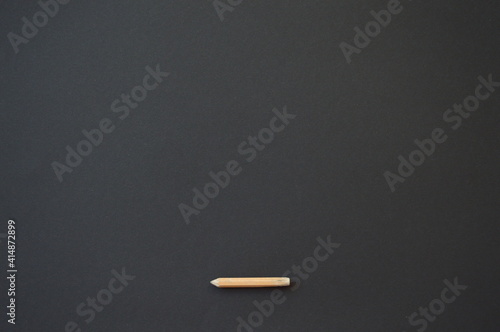 simple pencil on black background