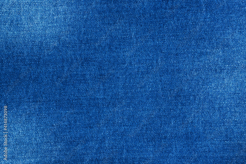 Texture blue denim with scuffs, background material of jeans. Texture blue denim with scuffs, background material of jeans.