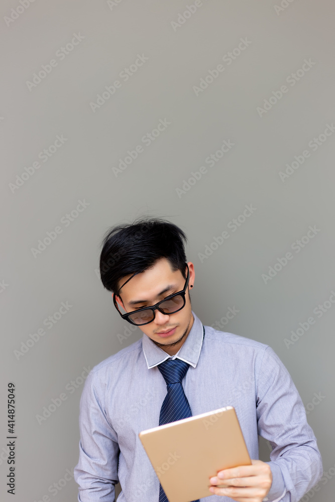 Young businessman working on digital tablet Attractive handsome young man wear sunglasses Modern guy chat with customer Searching for business or finding job on internet Business Technology concept Young businessman working on digital tablet Attractive handsome young man wear sunglasses Modern guy chat with customer Searching for business or finding job on internet Business Technology concept