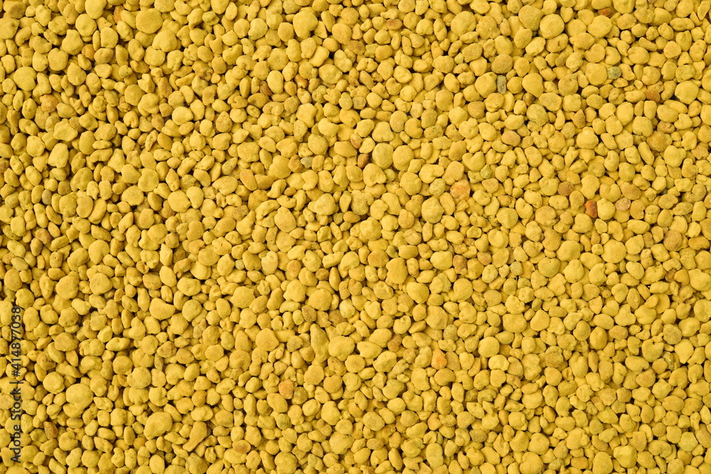 Golden bee pollen granules abstract background Golden bee pollen granules abstract background