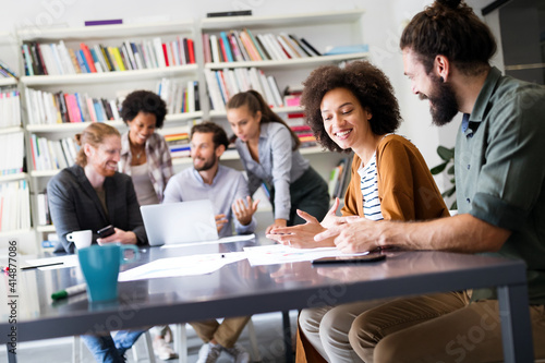 Group of business people collaborating on project in office