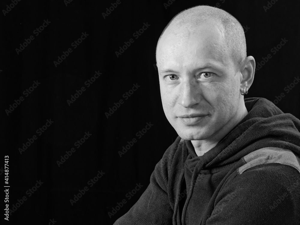 bw portrait of a bald man on a black background bw portrait of a bald man on a black background
