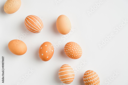 Happy Easter minimal concept. Simple Easter eggs isolated on white background. Flat lay, top view, overhead.