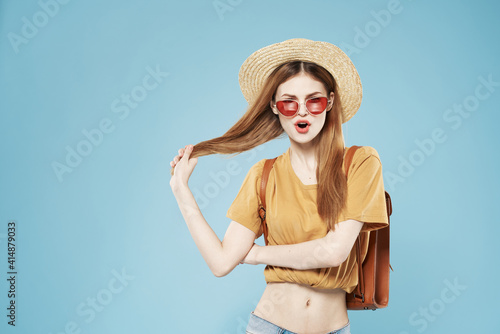 Cheerful pretty woman in hat and sunglasses hair backpack emotions lifestyle
