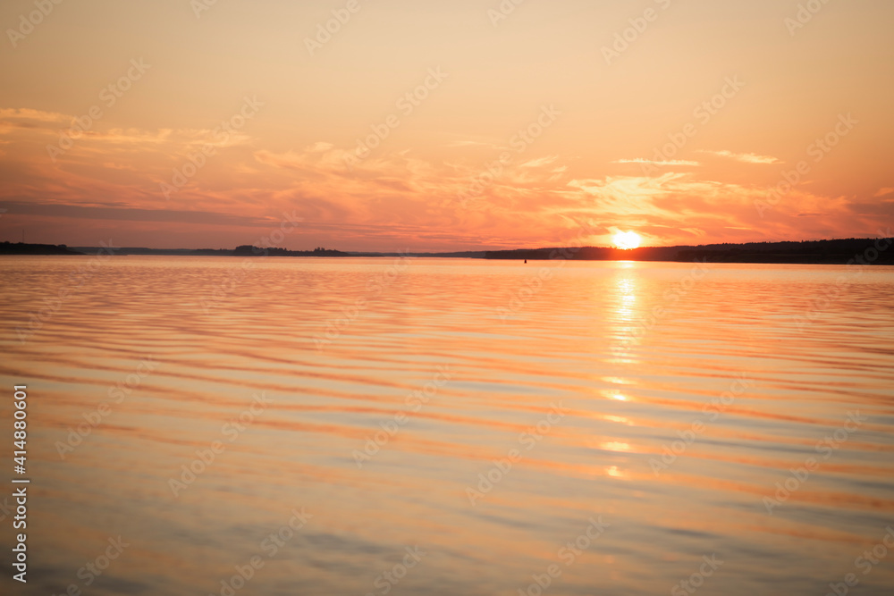 sunset in warm colors over the river, selective focus