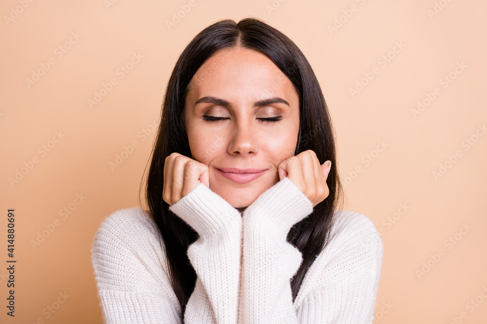 Photo of young attractive woman happy positive smile dream dreamy enjoy harmony isolated over beige color background Photo of young attractive woman happy positive smile dream dreamy enjoy harmony isolated over beige color background