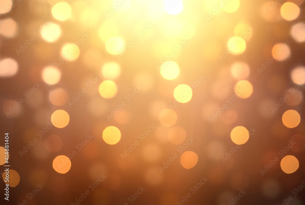 Obraz premium Holidays garland lights on golden blurred background abstract pattern.