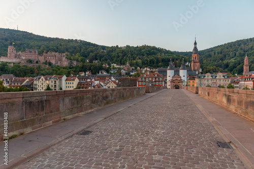 Sunrise view of the old bridge gate in Heidelberg, Germany photo