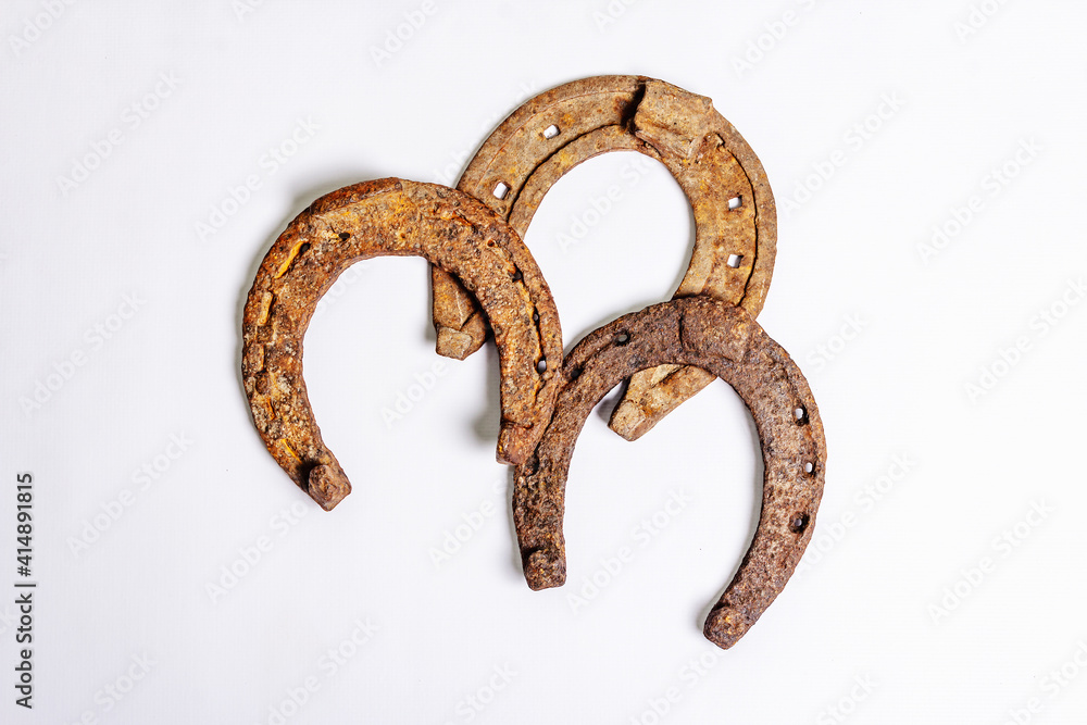 Cast iron metal horseshoes isolated on white background Cast iron metal horseshoes isolated on white background