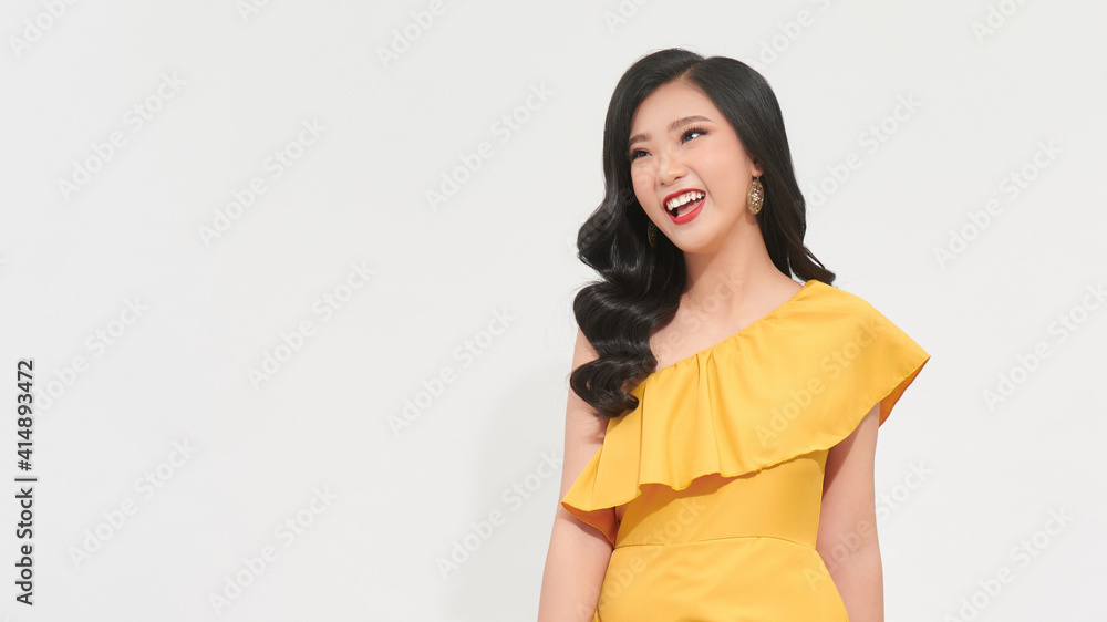 Happy charming woman with red lips smiling and having fun at party on isolated backdrop Happy charming woman with red lips smiling and having fun at party on isolated backdrop