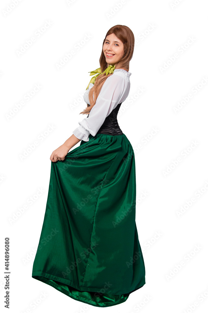 Woman in green skirt, black corset and white shirt posing isolated on white background. Saint patrick's day and oktoberfest celebration concept.