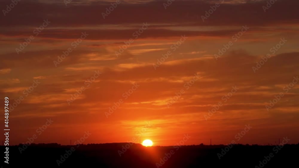 Beautiful Sunrise in the Colorful Sky, Time Lapse. The Sun Rises from the Horizon. The Rising Sun in the Colored Sky, Camera Slide. Beautiful Sunrise in the Colorful Sky, Time Lapse. The Sun Rises from the Horizon. The Rising Sun in the Colored Sky, Camera Slide.