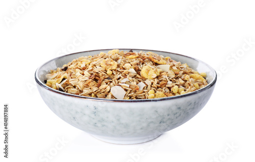 Bowl with fresh muesli on white background