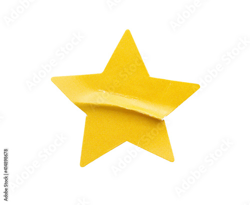 Yellow star shape paper sticker label isolated on white background