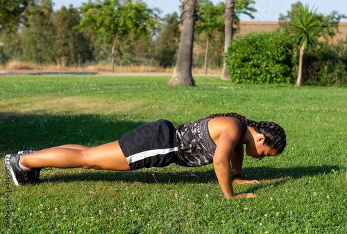 young woman doing push-ups