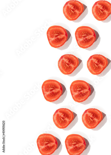 tomatoes pattern of fresh vegetables sliced on a white background