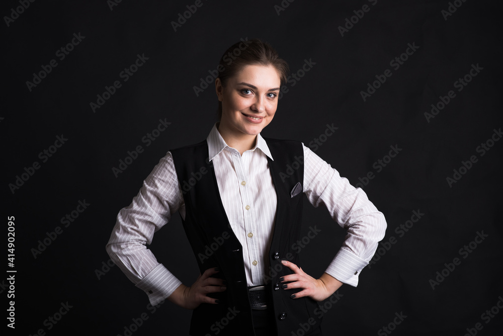 Obraz premium Portrait of a female business lady in the studio on a black background