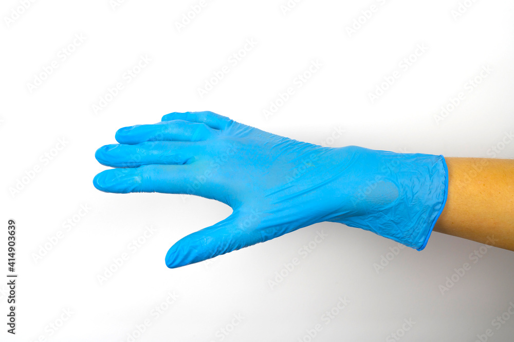Hand in blue medical gloves on a white background.