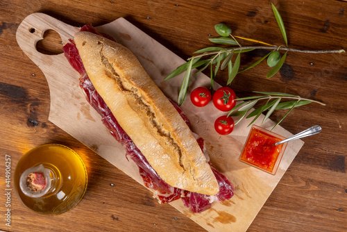 Fotografie Iberian ham sandwich typical of Spain
