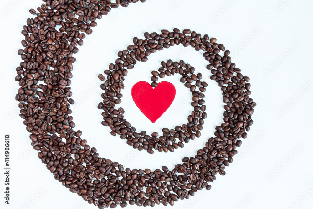a red heart surrounded by a spiral of coffee beans a red heart surrounded by a spiral of coffee beans