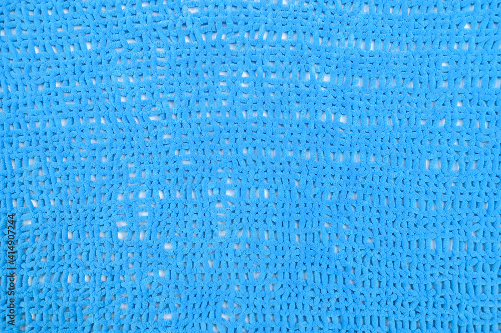 blue fabric in a hole, close up blue fabric in a hole, close up