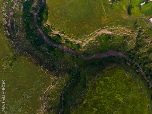 Aerial view of a green landscape with a river in the countryside