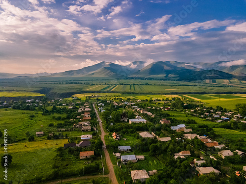 Wallpaper Mural Beautiful shot of a green landscape under a blue cloudy sky Torontodigital.ca